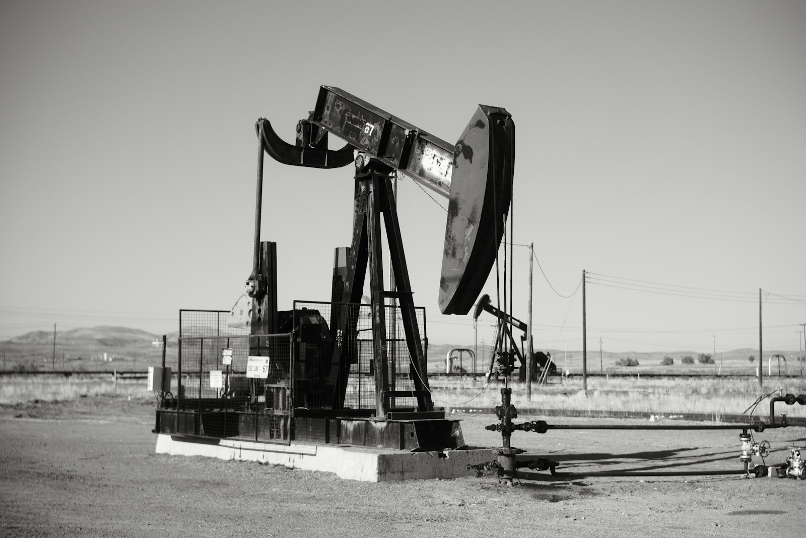 Photo by Jacob Padilla a black and white photo of an oil pump